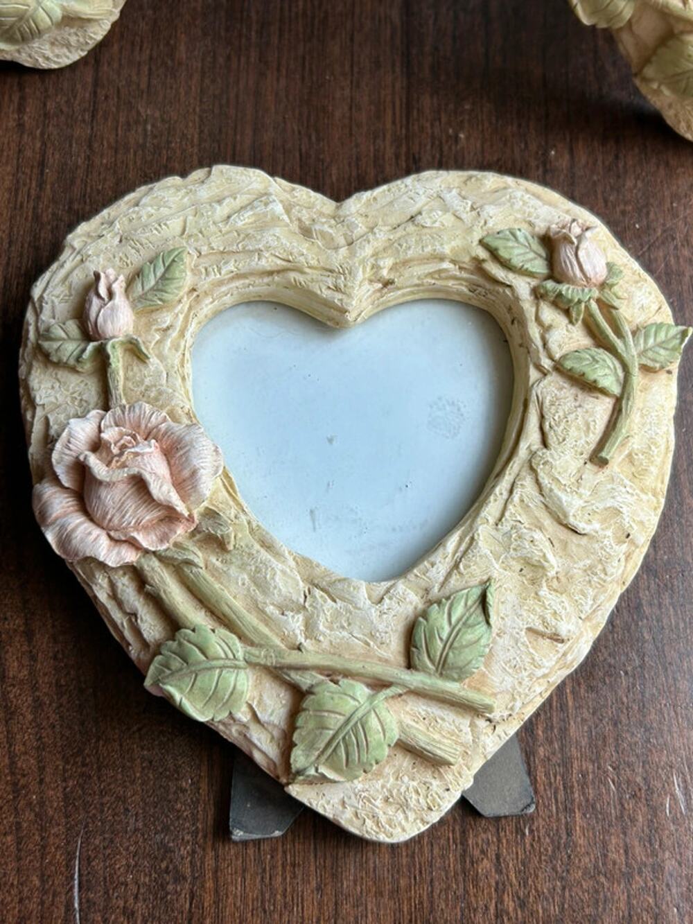 Vintage cast heart shaped picture frame textured pastel roses and green leaves
